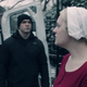 Offred (Elisabeth Moss) heads into a black police van at the end of season one.